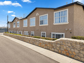 El Paso apartment for rent - A row of houses with stone walls on the side.