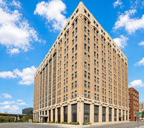 Chattanooga apartment for rent - A large, beige, rectangular building with many windows and a flat roof.