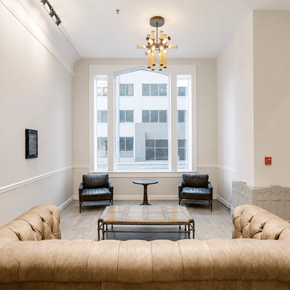 Chattanooga apartment for rent - A living room with a large window and a chandelier.