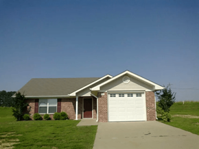 Alamo apartment for rent - a brick house with a white garage door