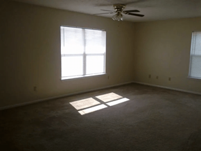 Alamo apartment for rent - an empty room with a window and a ceiling fan