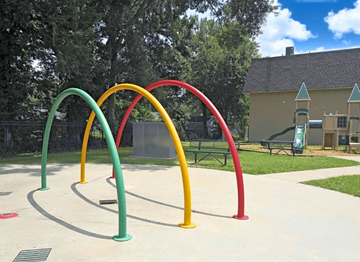 Baton Rouge townhouse for rent - A playground with a red, yellow, green and blue arch.