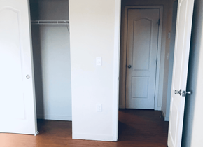 Aurora apartment for rent - an empty room with a closet and a white door