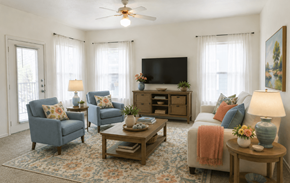 Kerrville apartment for rent - A living room with a television, two chairs, a sofa, and a coffee table.