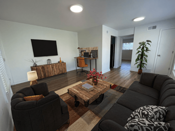 A living room with couches and a coffee table