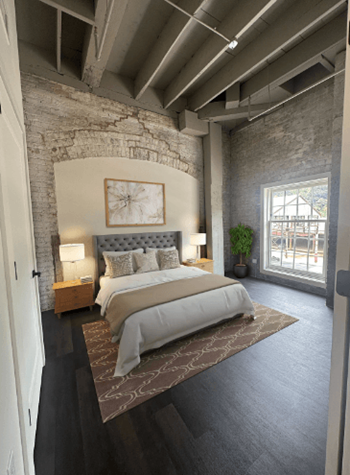 A bedroom with a bed and a window
