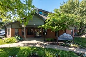 St. Louis apartment for rent - A building with a green roof and a sign that says "Information Center" in front of it.