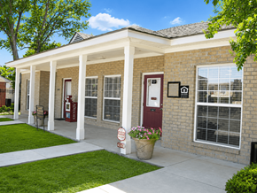 Baton Rouge townhouse for rent - A house with a red door and a sign that says "For Sale".