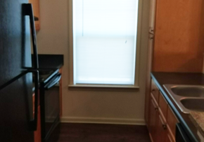 Tupelo townhouse for rent - a kitchen with a sink and a window