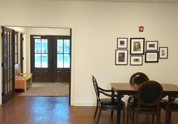 Tupelo townhouse for rent - a dining room and living room with a table and chairs