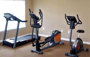 Shelbyville apartment for rent - a group of exercise machines in a room