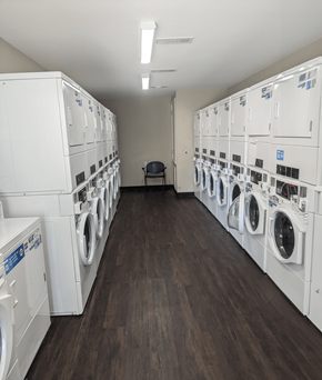 Little Rock apartment for rent - a room full of washers and dryers in a laundry room