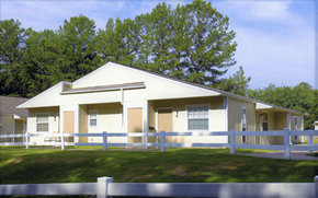 Little Rock apartment for rent - the front of a white house with a white fence