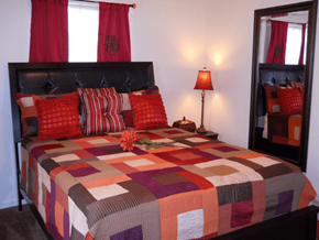 Memphis apartment for rent - a bedroom with a bed with a colorful quilt