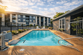 Boerne apartment for rent - A swimming pool in front of a building with a sunny day.
