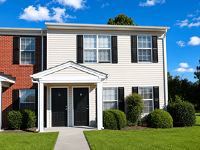 Portsmouth apartment for rent - A house with a red brick section and a white siding section with a black door and windows.