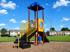 Portsmouth apartment for rent - A playground with a blue and yellow slide and a red and yellow staircase.