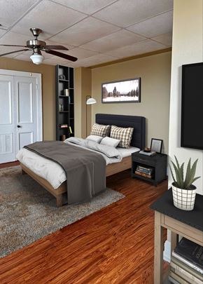 Little Rock apartment for rent - a bedroom with a bed and a ceiling fan
