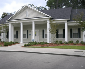 Waycross apartment for rent - A white house with a grey roof and a porch.