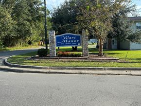 Waycross apartment for rent - A sign for Waterfront is displayed in front of a building.
