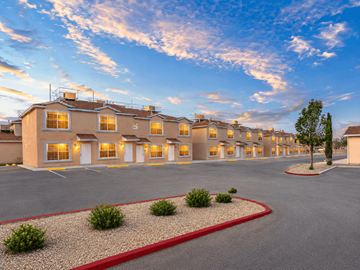 El Paso townhouse for rent - A parking lot in front of a building with a red border.