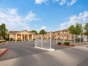 El Paso townhouse for rent - A gated community with a large building in the background.