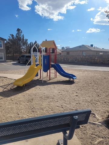 Horizon townhouse for rent - A playground with a yellow slide and a blue slide.