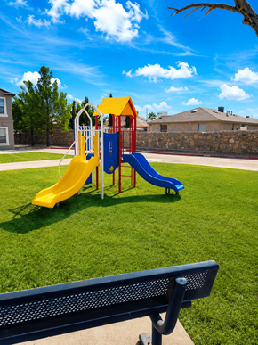 Horizon townhouse for rent - A playground with a yellow and blue slide.