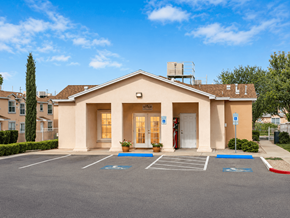 El Paso townhouse for rent - A building with a parking lot in front of it.