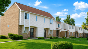Loveland townhouse for rent - A row of houses with brown roofs and white walls.