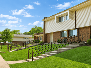 Loveland townhouse for rent - A building with a staircase leading to the front door.