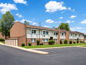 Loveland townhouse for rent - Apartment building with a parking lot in front.