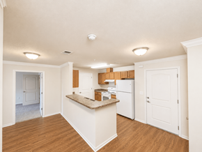 Cleveland apartment for rent - A kitchen with white appliances and wooden cabinets.