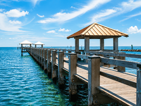 Gulfport apartment for rent - A wooden pier with a gazebo extends into the water.
