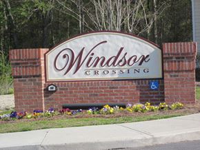 Lumberton apartment for rent - a sign for windsor crossing in front of a building