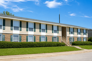 Thomasville apartment for rent - A building with a green lawn in front.