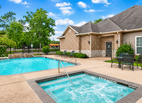 Conroe apartment for rent - A swimming pool in front of a house.