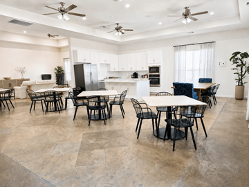 Conroe apartment for rent - A spacious kitchen and dining area with a table set for six.