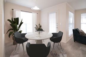 Austin apartment for rent - A modern dining room with a round table and chairs.