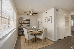 North Little Rock apartment for rent - A dining room with a table set for two and a ceiling fan.