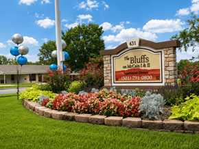 North Little Rock apartment for rent - A sign for The Bluffs on McCain & II Apartment Homes with a phone number on it.