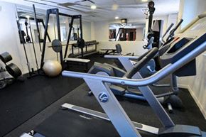Denver apartment for rent - a gym with a bunch of exercise equipment in it