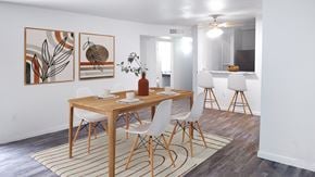 Houston townhouse for rent - A dining room with a wooden table and chairs.