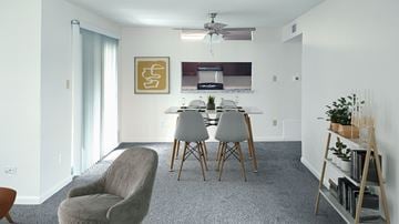 Houston townhouse for rent - A living room with a grey carpet and a grey chair.