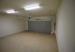 New Albany apartment for rent - an empty room with a garage door in it