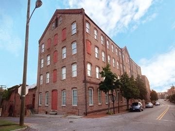 Petersburg apartment for rent - a large brick building on the side of a street