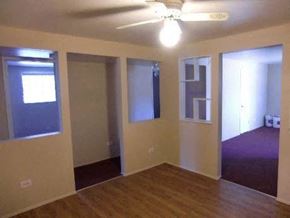 Lakewood apartment for rent - an empty living room with a ceiling fan