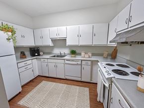 Memphis apartment for rent - A kitchen with white cabinets and appliances.