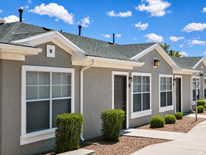 El Paso townhouse for rent - A row of houses with grey walls and white windows.
