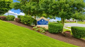 Capitol Heights townhouse for rent - A sign that says Millwood stands in a grassy area.